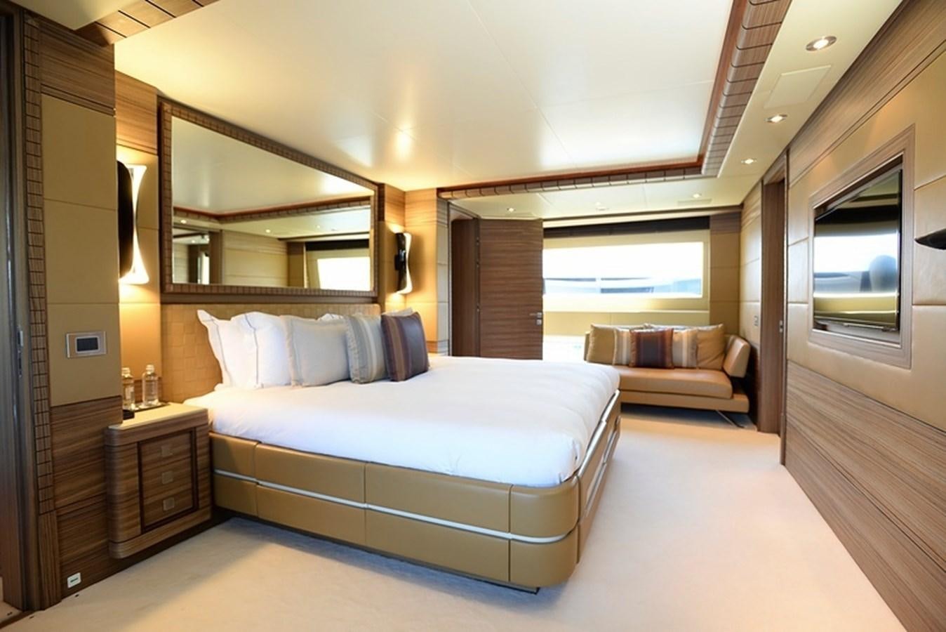 a large bedroom with a bed aboard ORYX Yacht for Sale