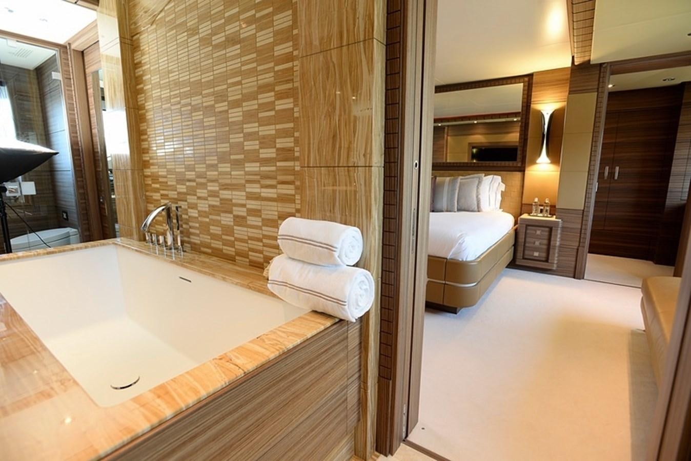 a bathroom with a tub sink and toilet aboard ORYX Yacht for Sale
