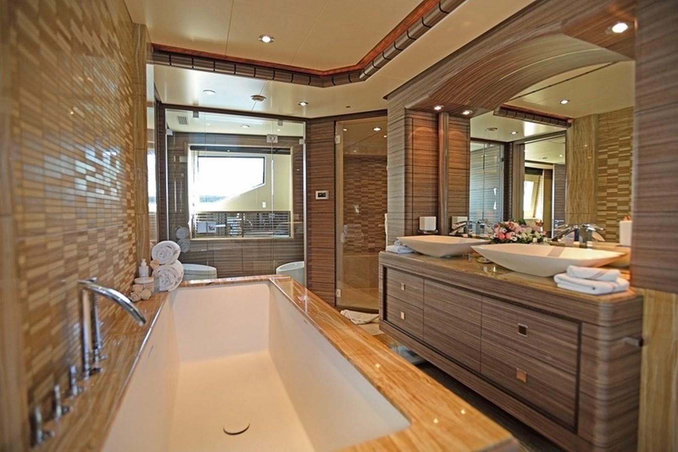 a bathroom with a large bathtub aboard ORYX Yacht for Sale