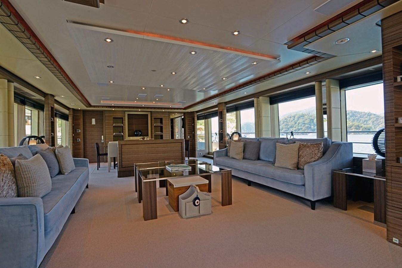 a living room with a couch and a coffee table aboard ORYX Yacht for Sale
