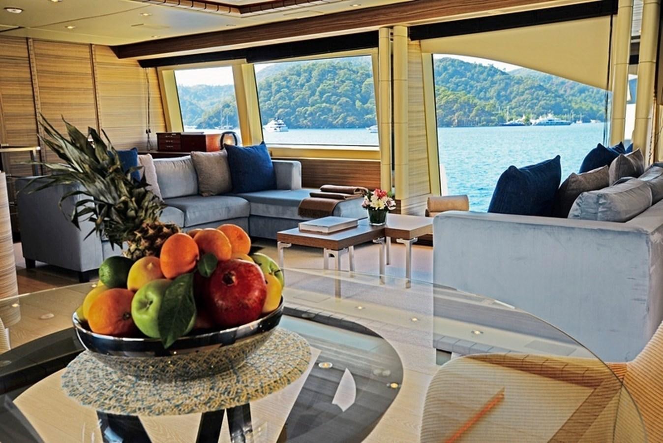 a living room with a large window aboard ORYX Yacht for Sale