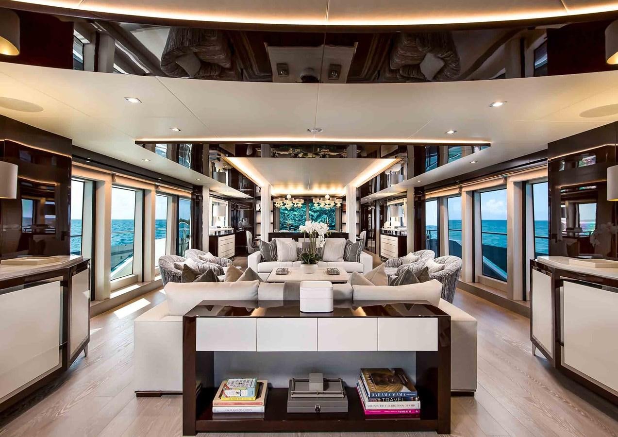 a room with a table and chairs aboard CAPTAIN MORGAN III Yacht for Sale