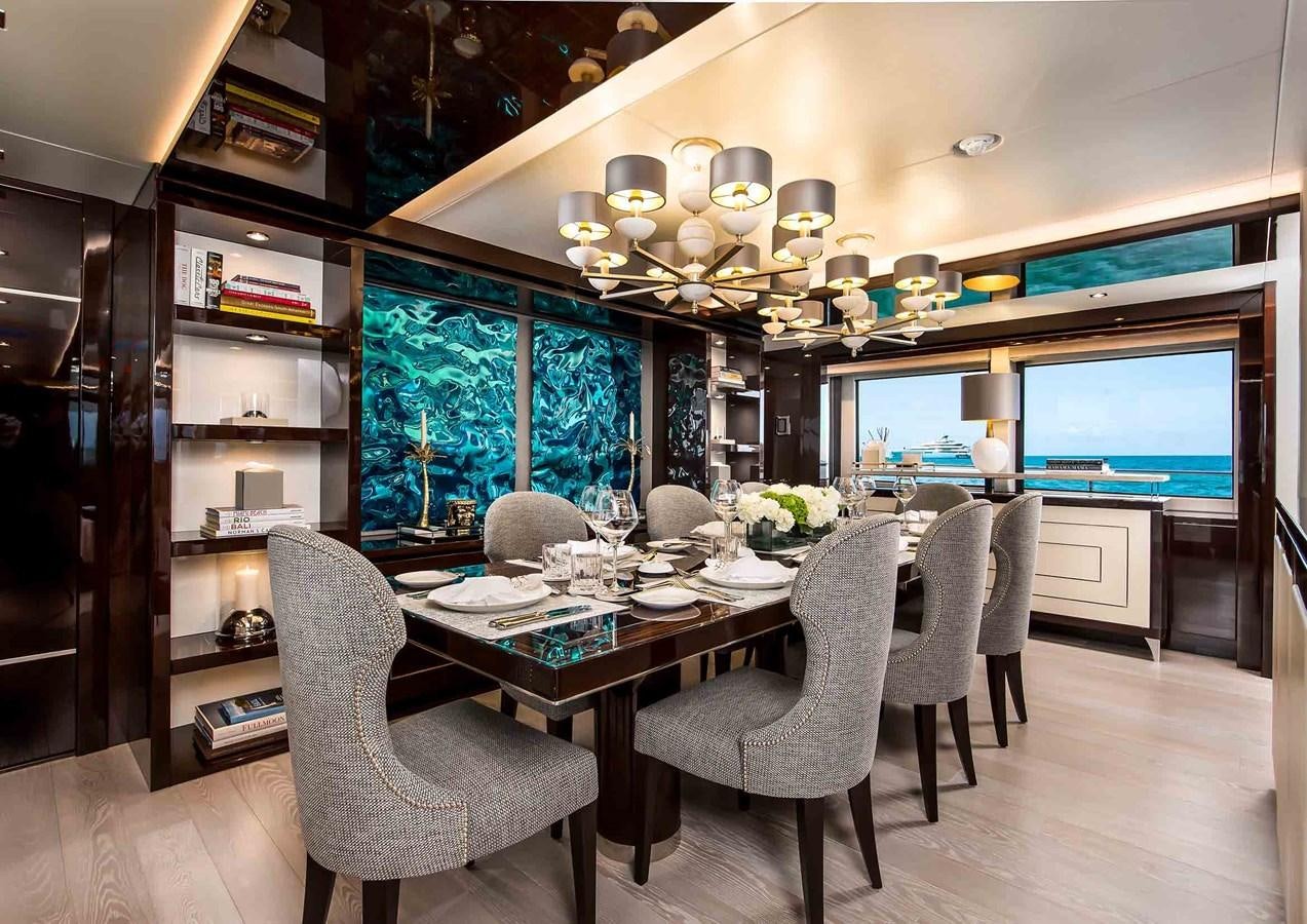a dining room with a large table aboard CAPTAIN MORGAN III Yacht for Sale