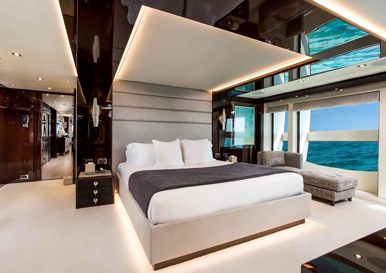 a room with a bed and a large window aboard CAPTAIN MORGAN III Yacht for Sale