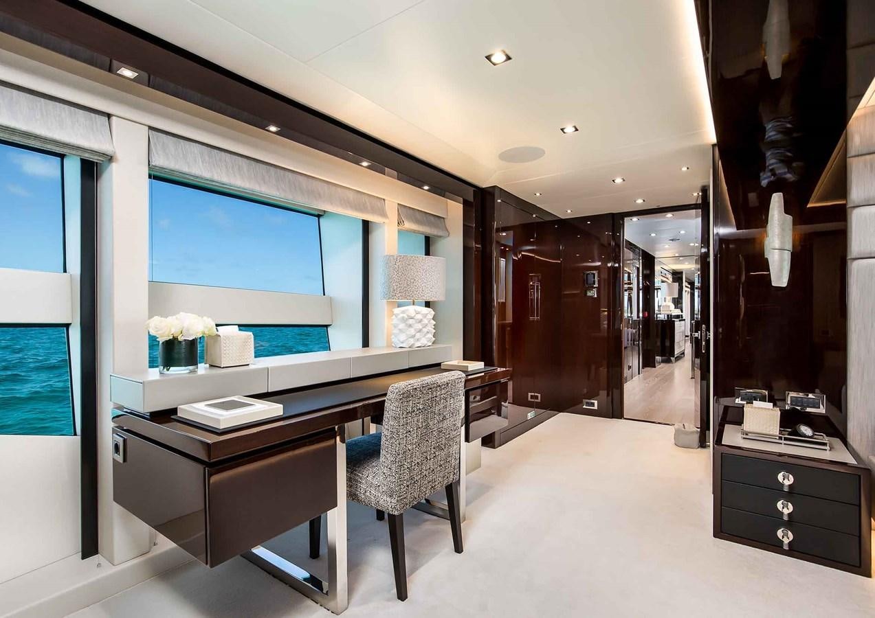 a room with a desk and a window aboard CAPTAIN MORGAN III Yacht for Sale