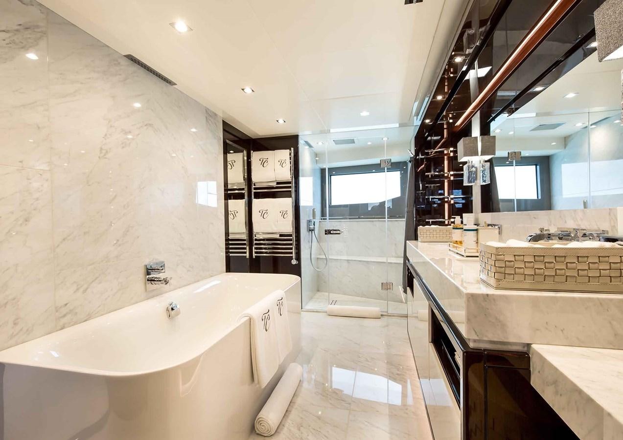 a large bathroom with a large tub aboard CAPTAIN MORGAN III Yacht for Sale