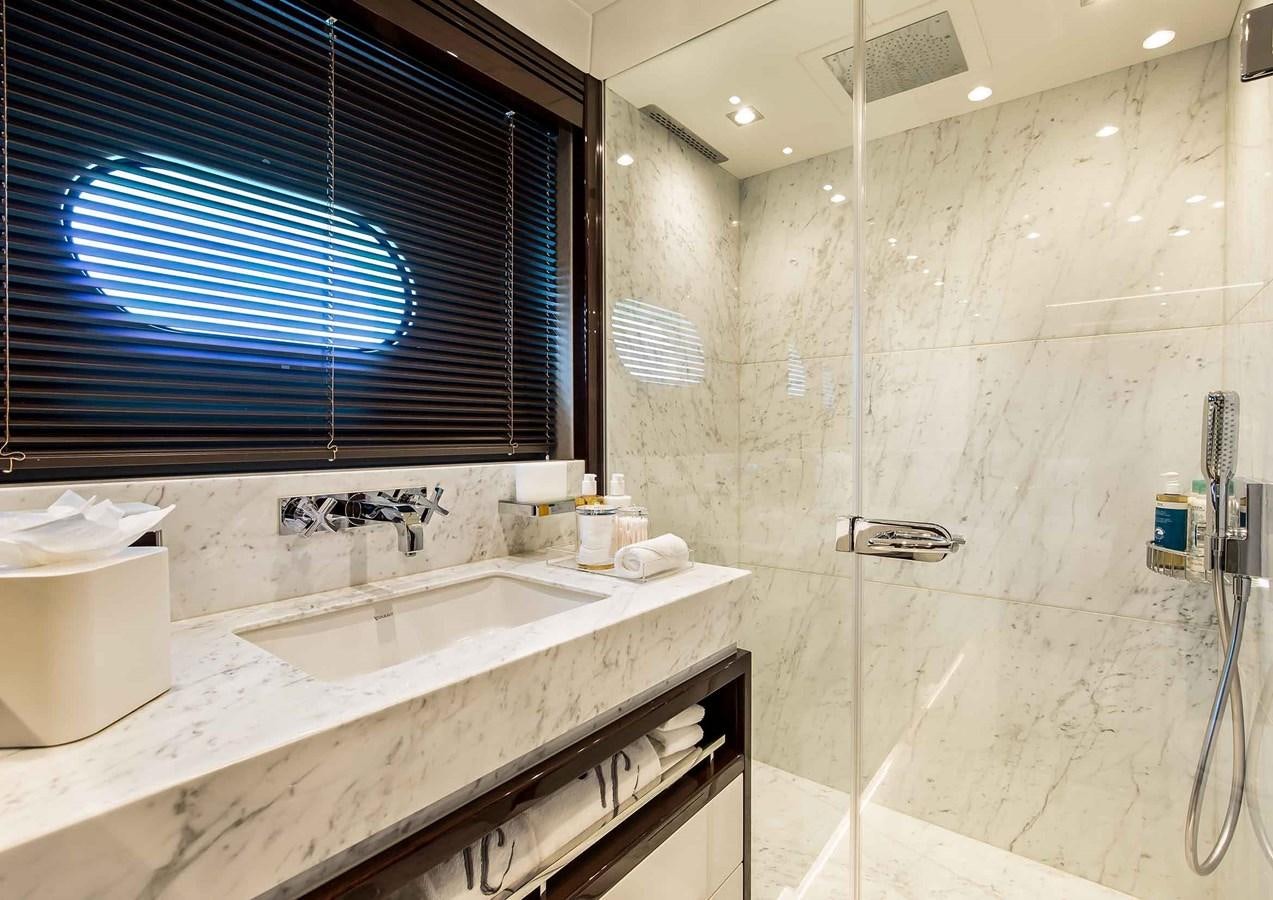 a bathroom with a sink and a window aboard CAPTAIN MORGAN III Yacht for Sale