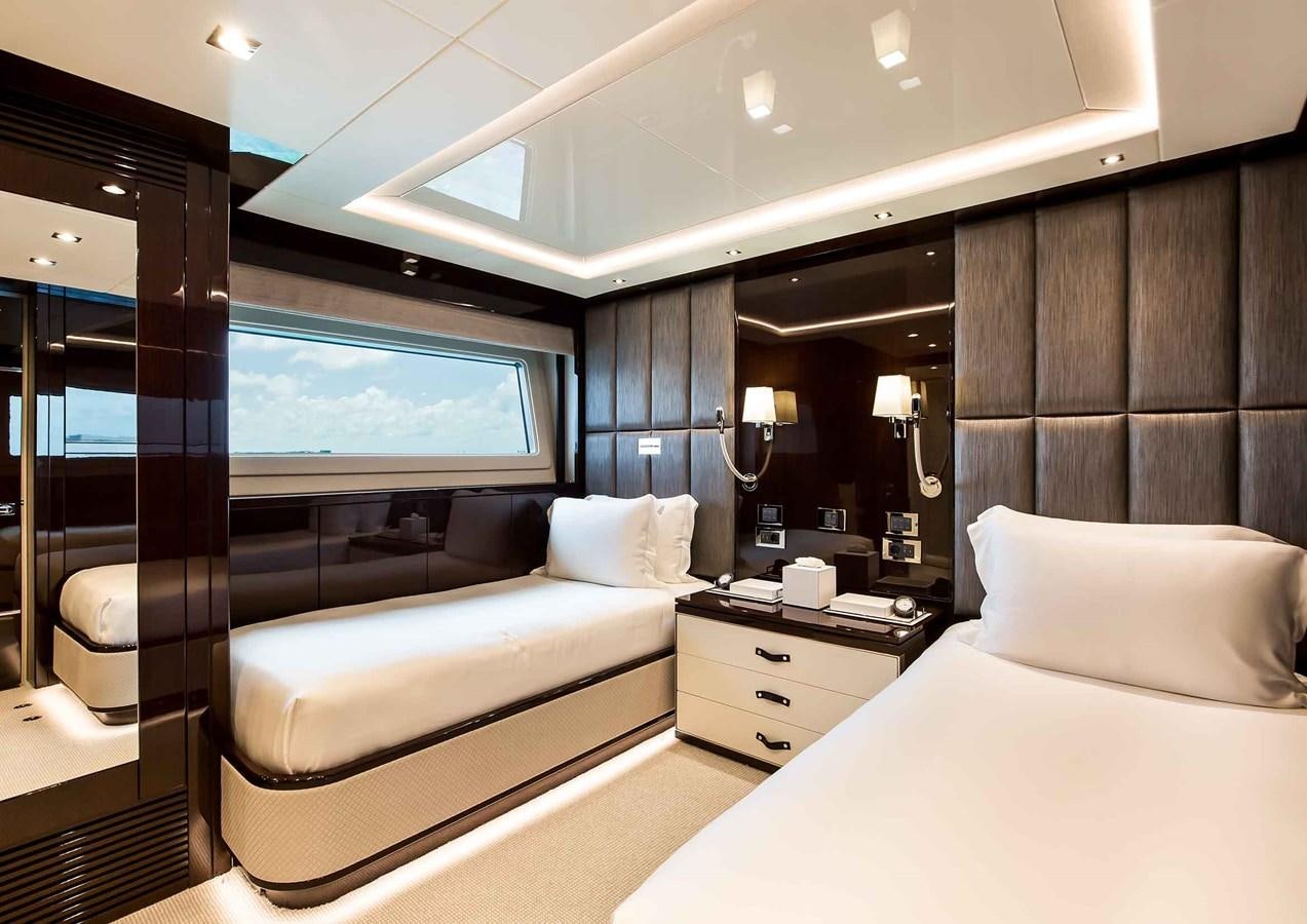 a hotel room with a bed and a tv aboard CAPTAIN MORGAN III Yacht for Sale