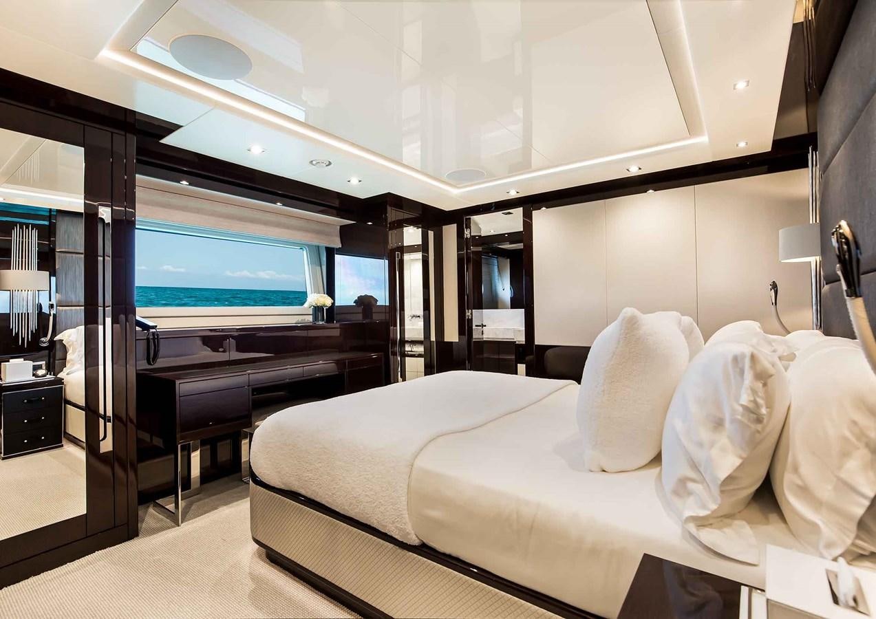 a room with a bed and a tv aboard CAPTAIN MORGAN III Yacht for Sale