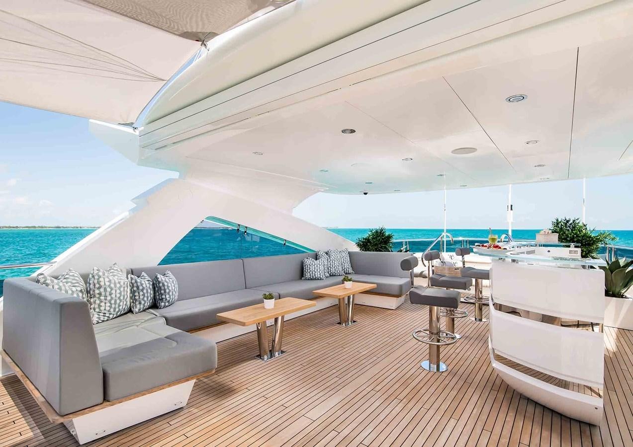 a room with a pool and a deck aboard CAPTAIN MORGAN III Yacht for Sale