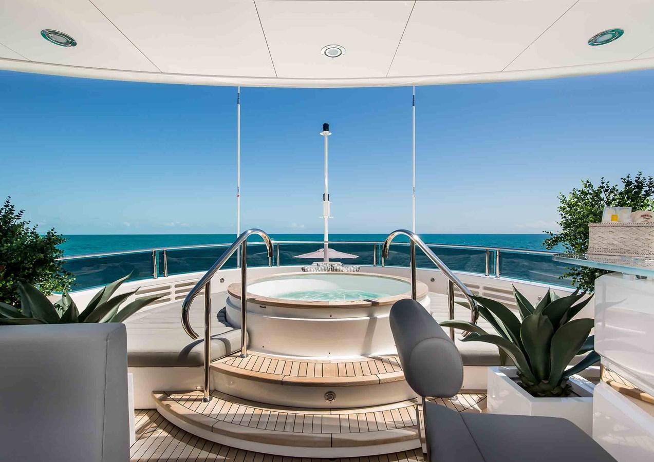 a table on a balcony aboard CAPTAIN MORGAN III Yacht for Sale