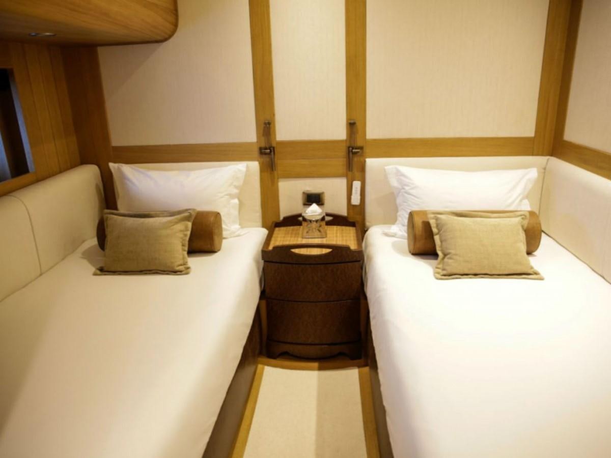 a hotel room with two beds aboard ZANZIBA Yacht for Sale