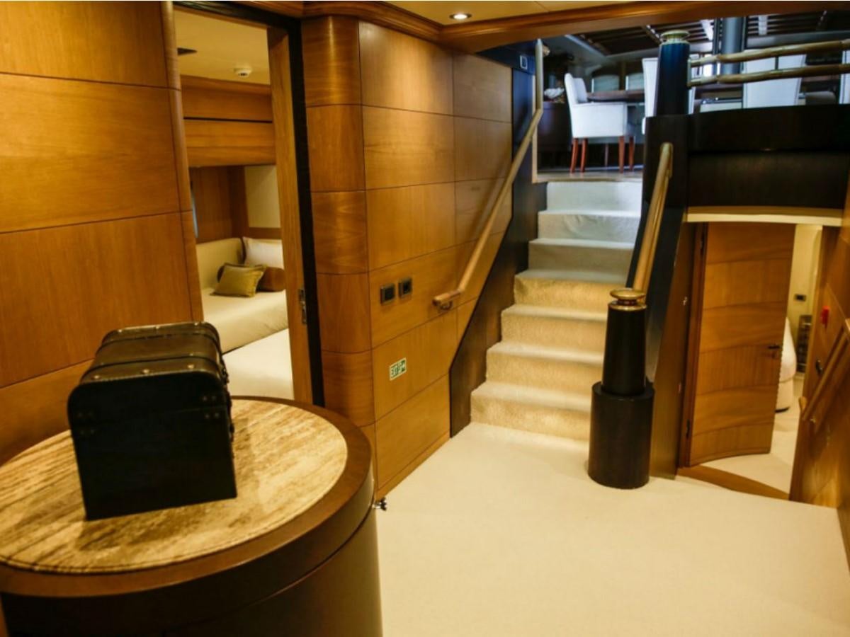 a room with a bed and a table aboard ZANZIBA Yacht for Sale