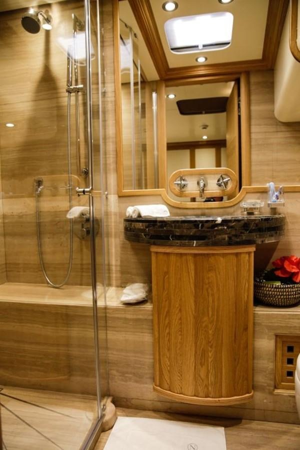 a bathroom with a glass shower aboard ZANZIBA Yacht for Sale