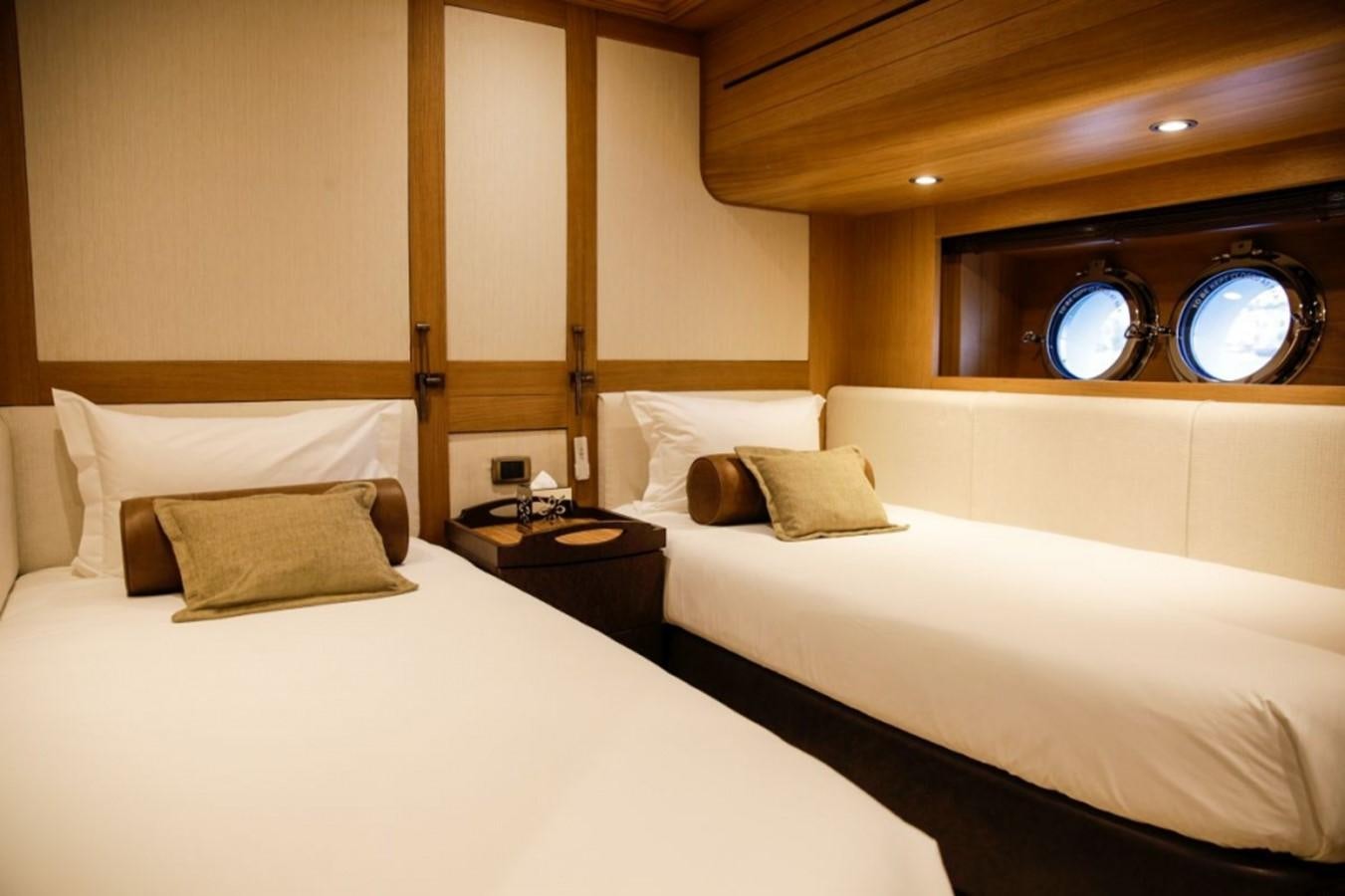 a room with two beds aboard ZANZIBA Yacht for Sale