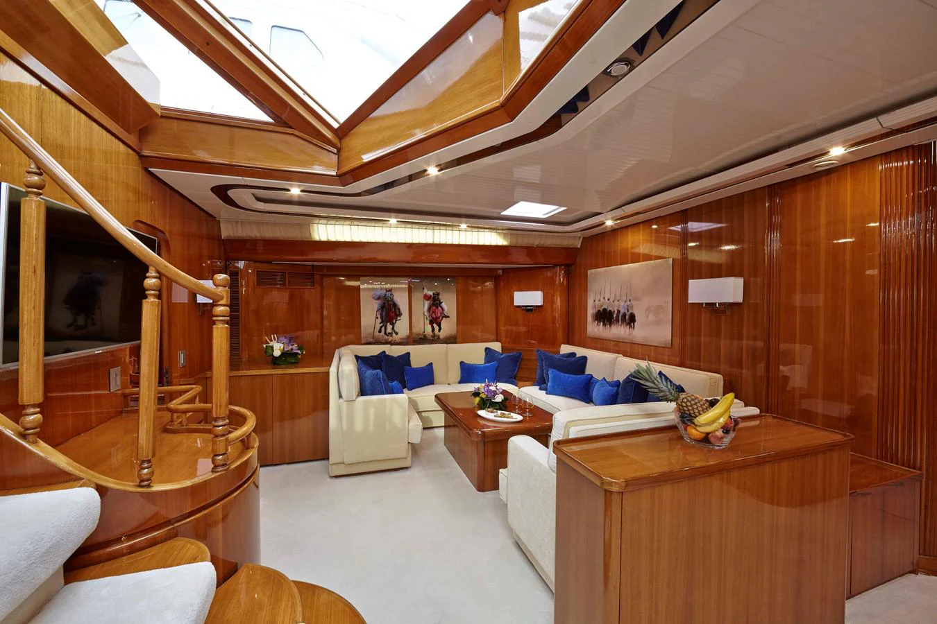 a large room with a bed and a table aboard MIRABELLA Yacht for Sale