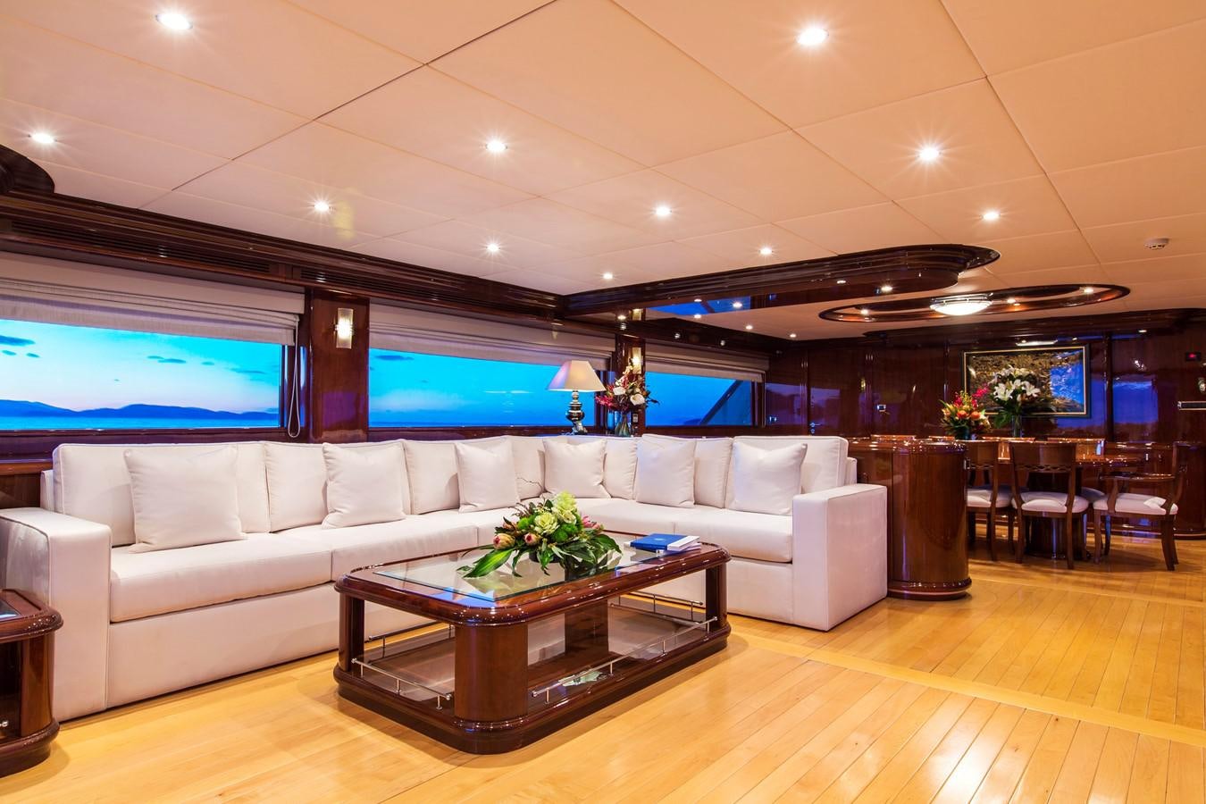 a living room with a large screen aboard SILENTWORLD Yacht for Sale