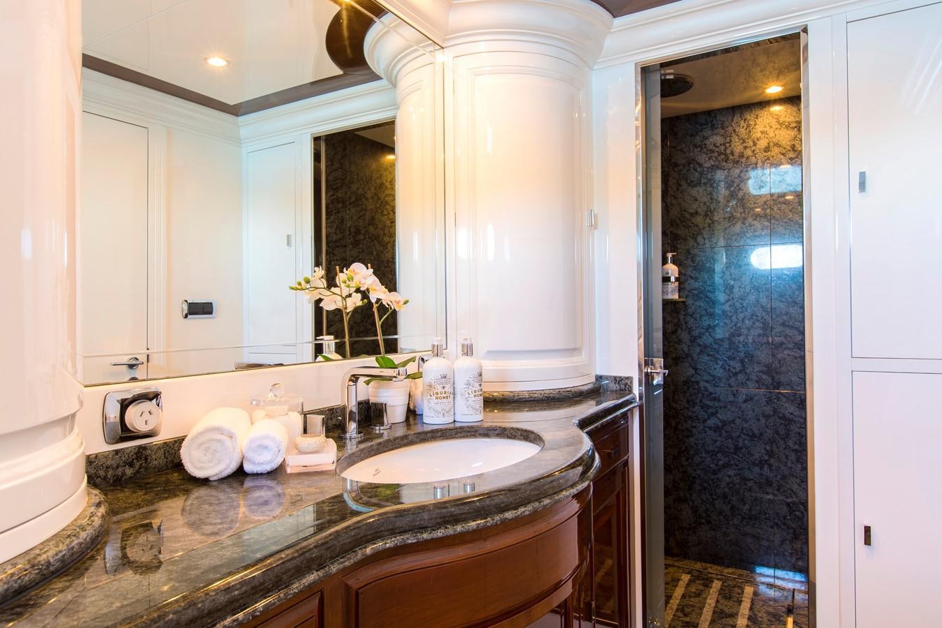 a bathroom with a sink and a mirror aboard SILENTWORLD Yacht for Sale