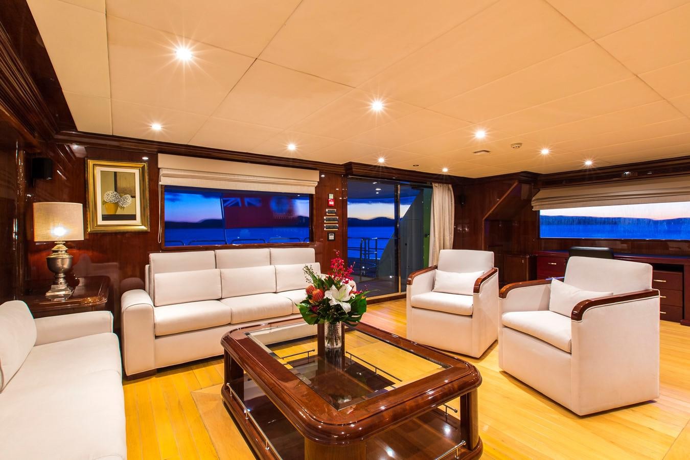 a living room with a large screen aboard SILENTWORLD Yacht for Sale