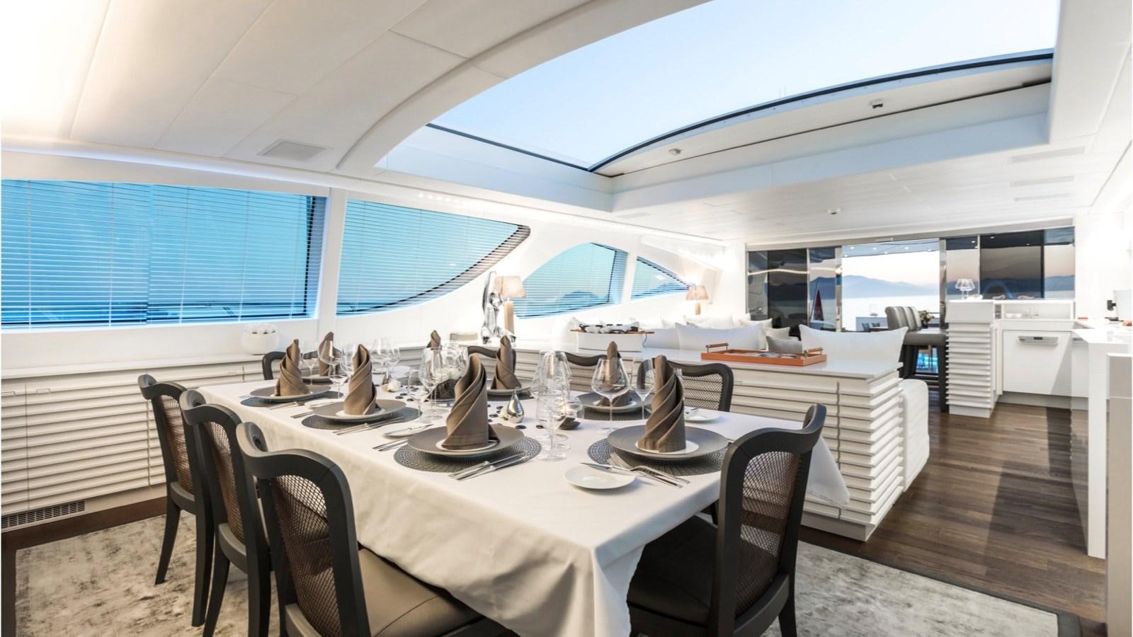 a dining table in a room aboard BEACHOUSE Yacht for Charter