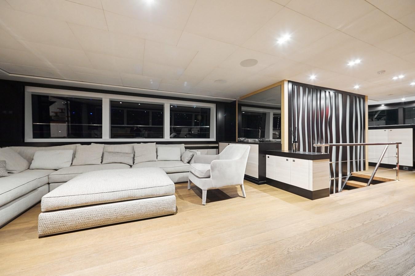 a living room with a large window aboard NORTH STAR Yacht for Sale