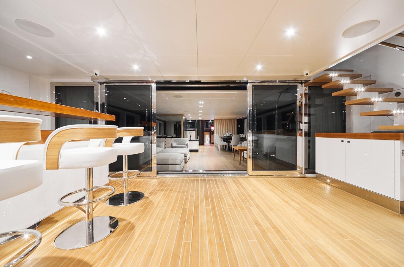 a large room with tables and chairs aboard NORTH STAR Yacht for Sale
