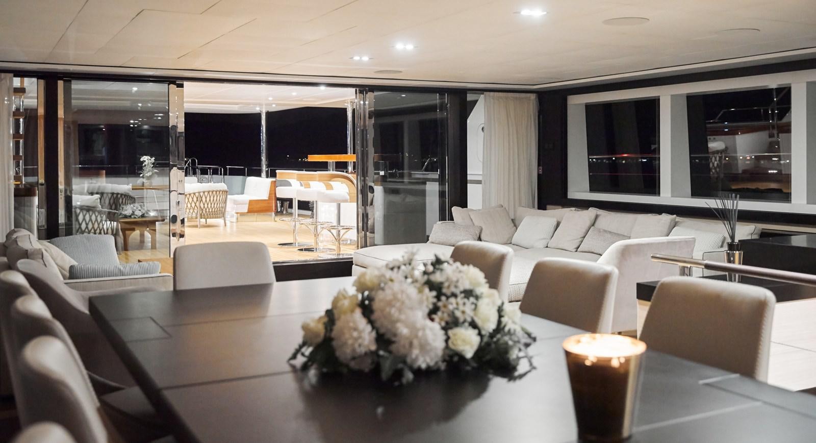 a large room with chairs and tables aboard NORTH STAR Yacht for Sale