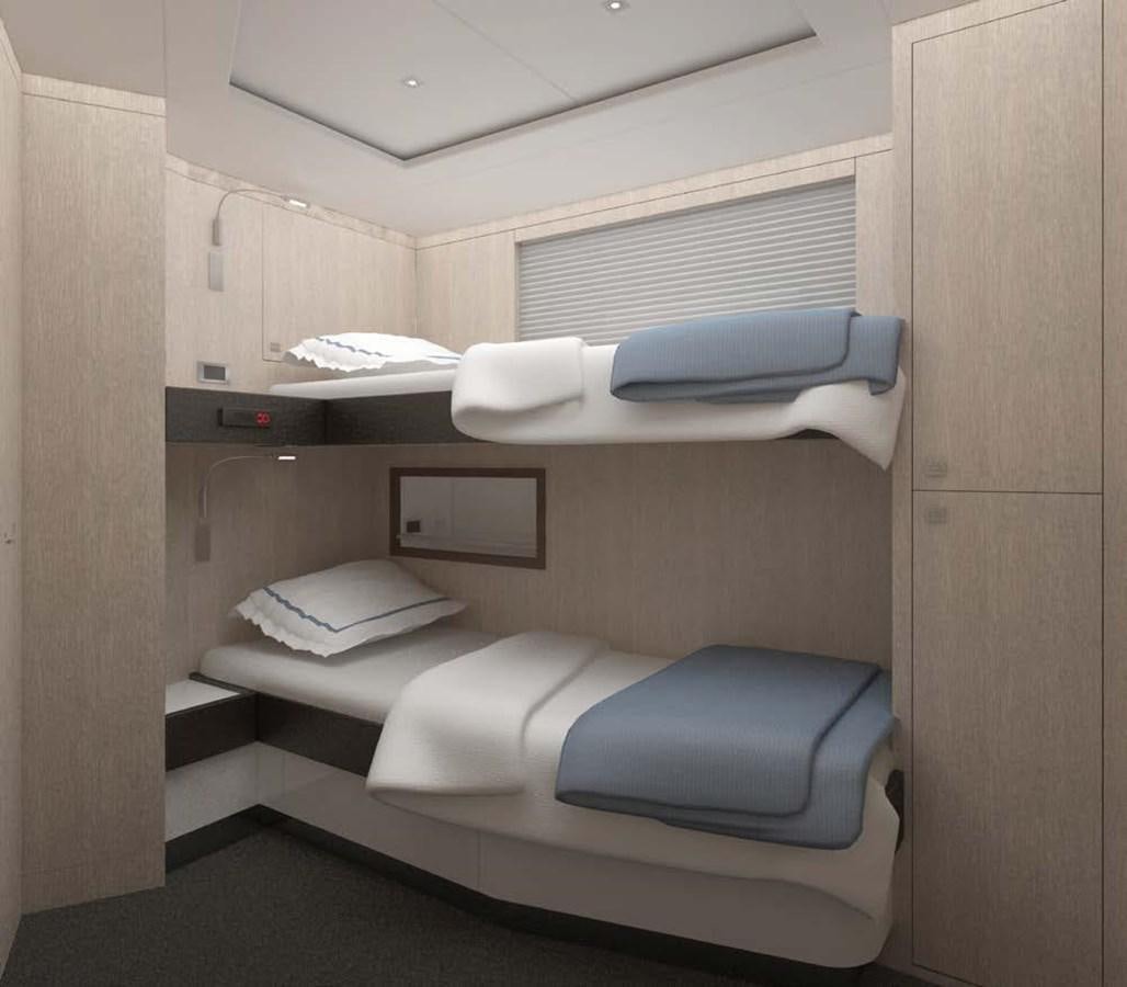 a small room with a bed and a desk aboard NORTH STAR Yacht for Sale