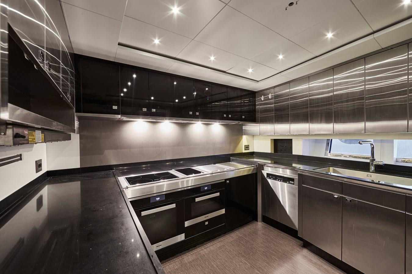 a kitchen with a large island aboard NORTH STAR Yacht for Sale