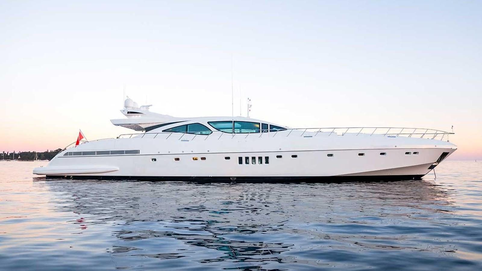a white yacht on the water aboard BEACHOUSE Yacht for Sale