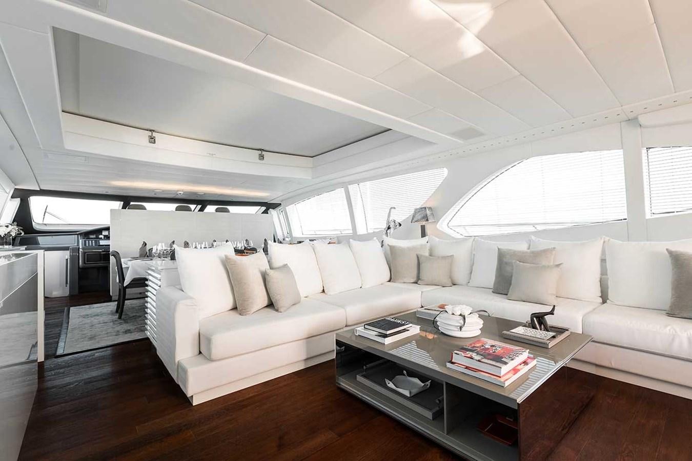 a living room with a couch and a coffee table aboard BEACHOUSE Yacht for Charter
