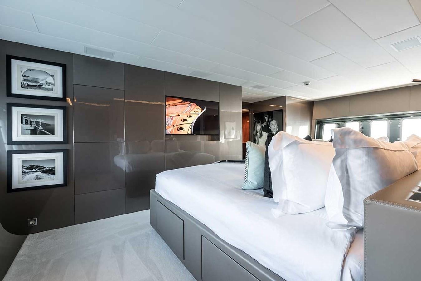 a room with a bed and a couch aboard BEACHOUSE Yacht for Sale