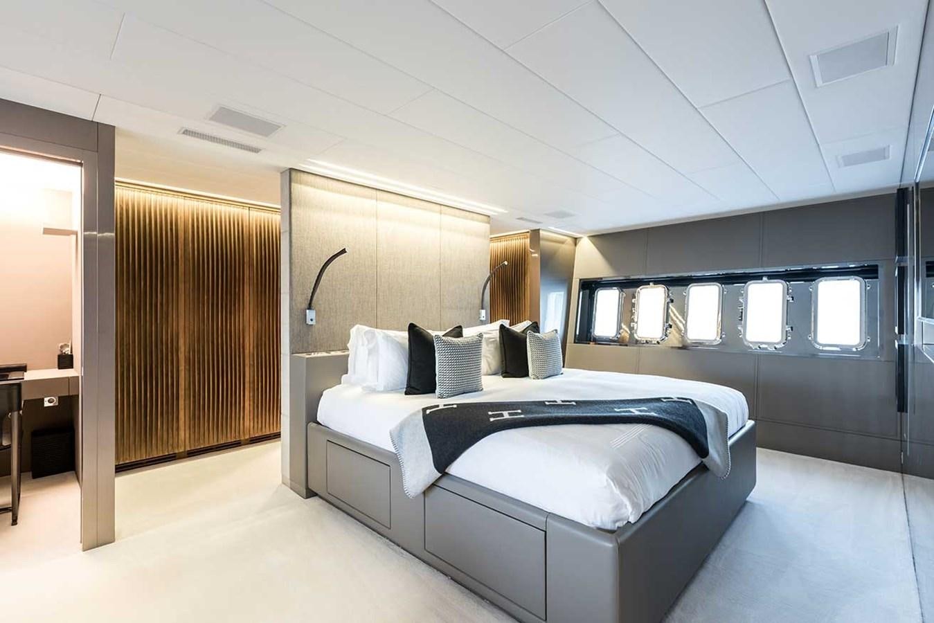 a room with a bed and a window aboard BEACHOUSE Yacht for Sale