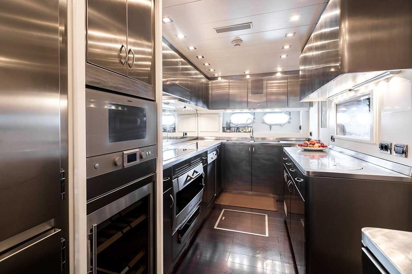 a kitchen with stainless steel appliances aboard BEACHOUSE Yacht for Sale