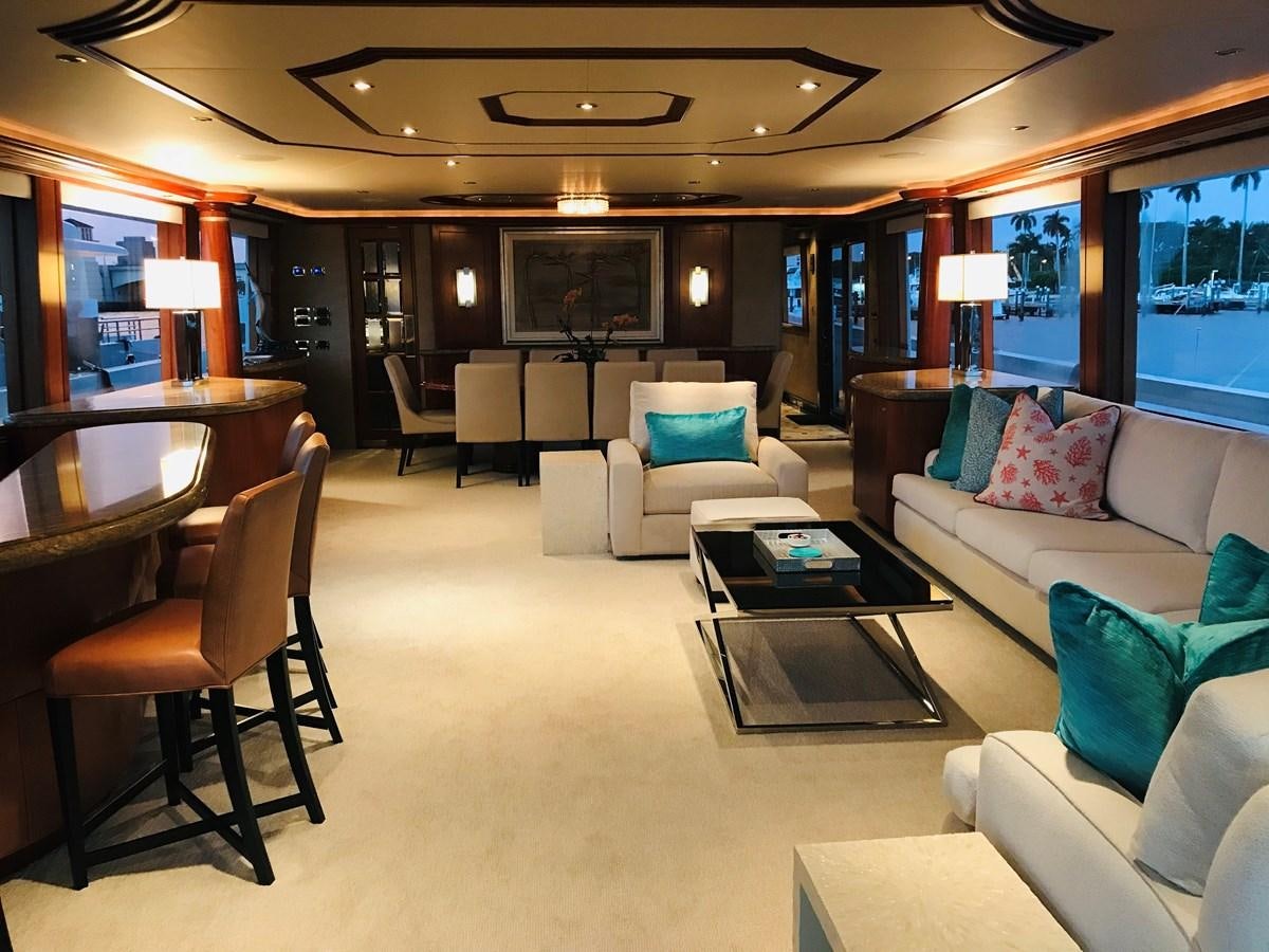 a living room with a large screen aboard RELENTLESS Yacht for Sale
