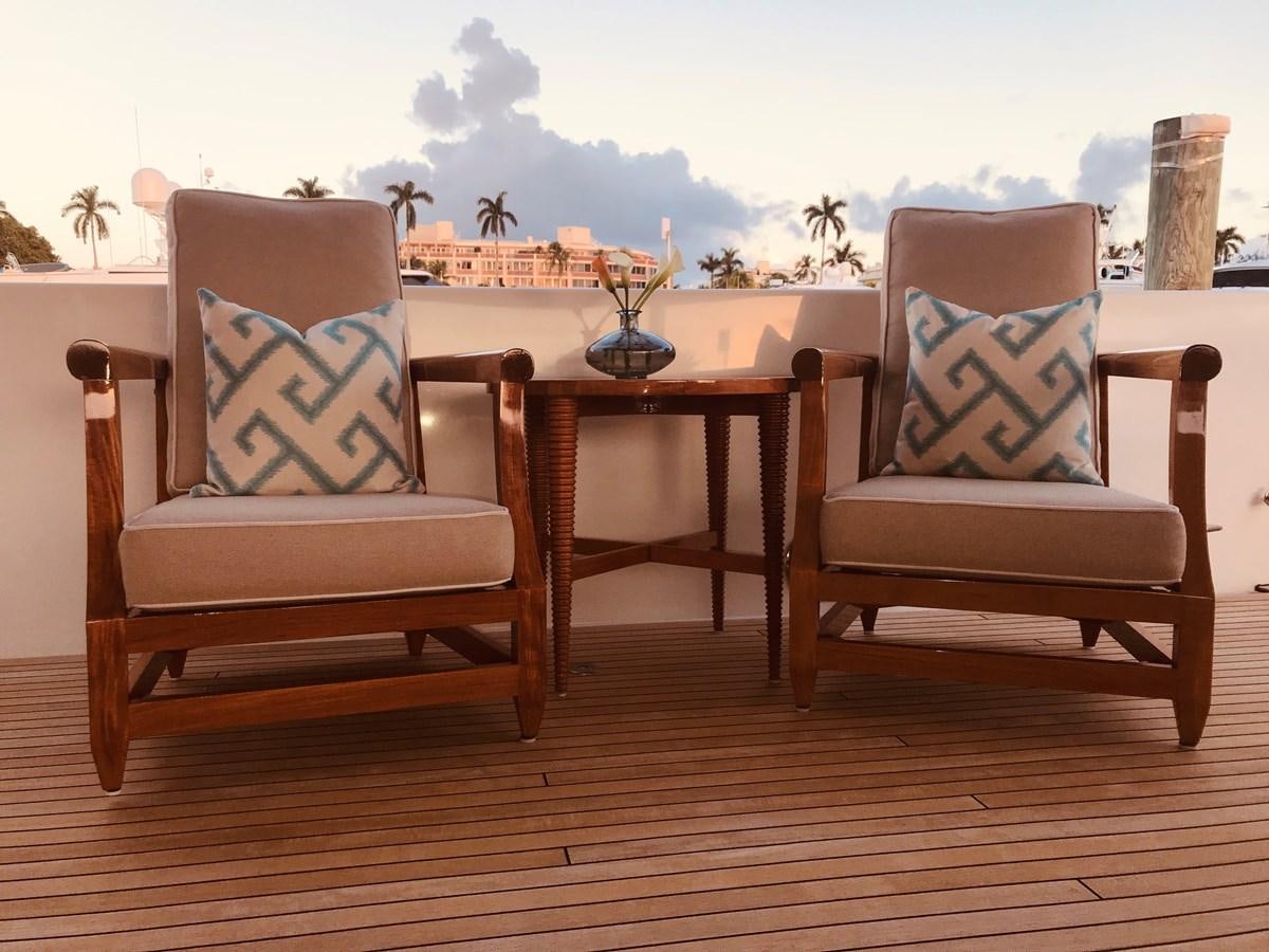 a couple of chairs and a table aboard RELENTLESS Yacht for Sale