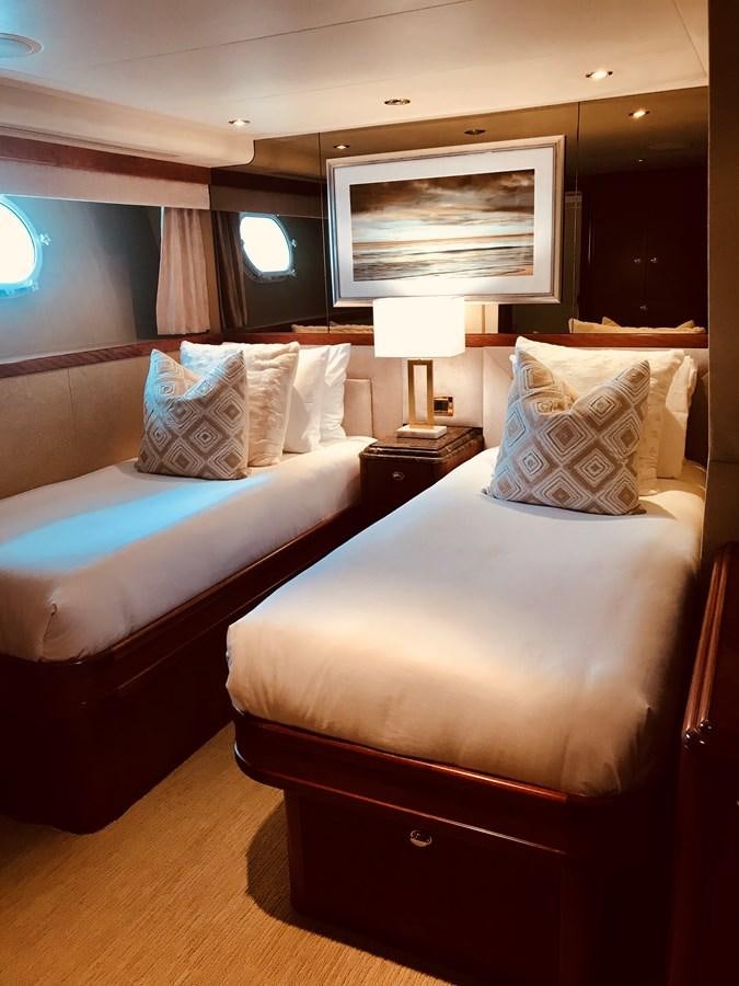 a couple of beds in a hotel room aboard RELENTLESS Yacht for Sale