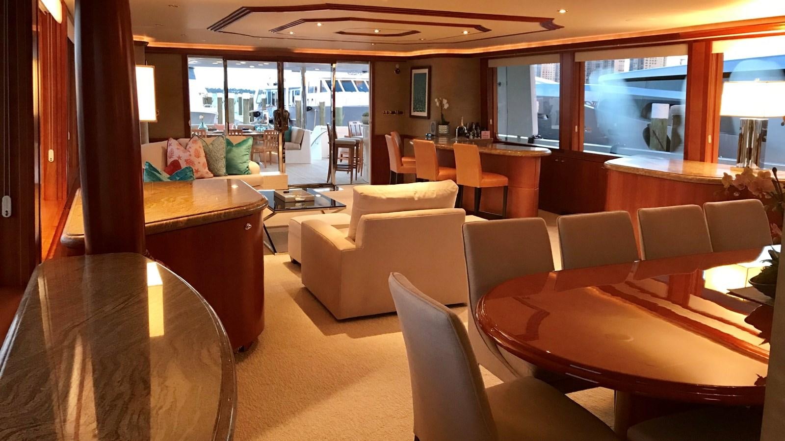 a room with couches and a table aboard RELENTLESS Yacht for Sale