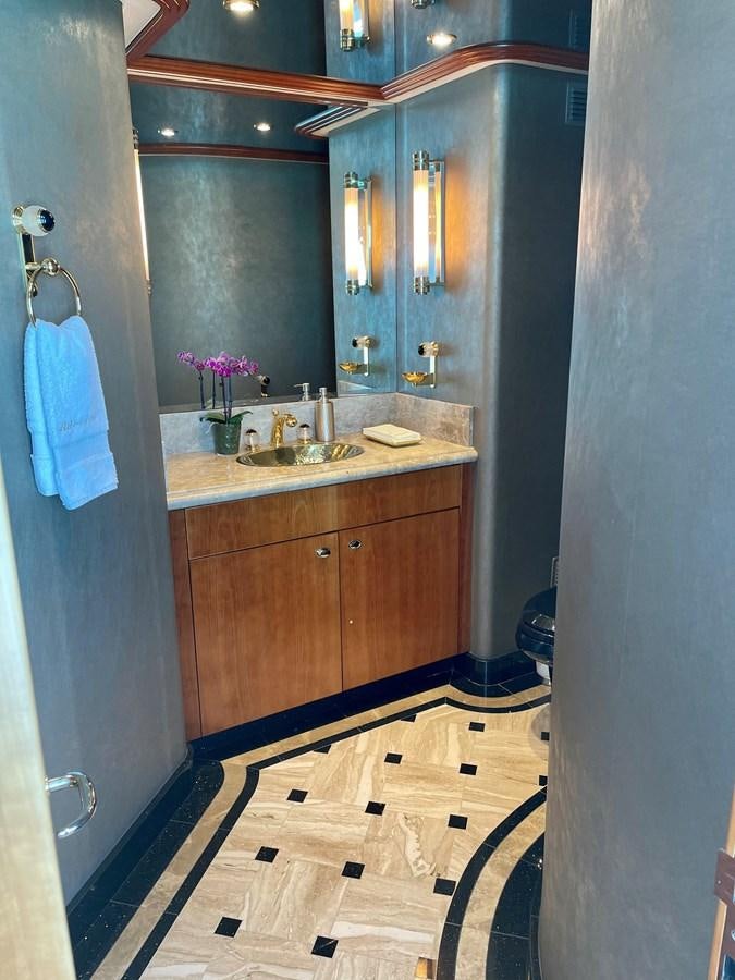 a bathroom with a sink and a mirror aboard RELENTLESS Yacht for Sale