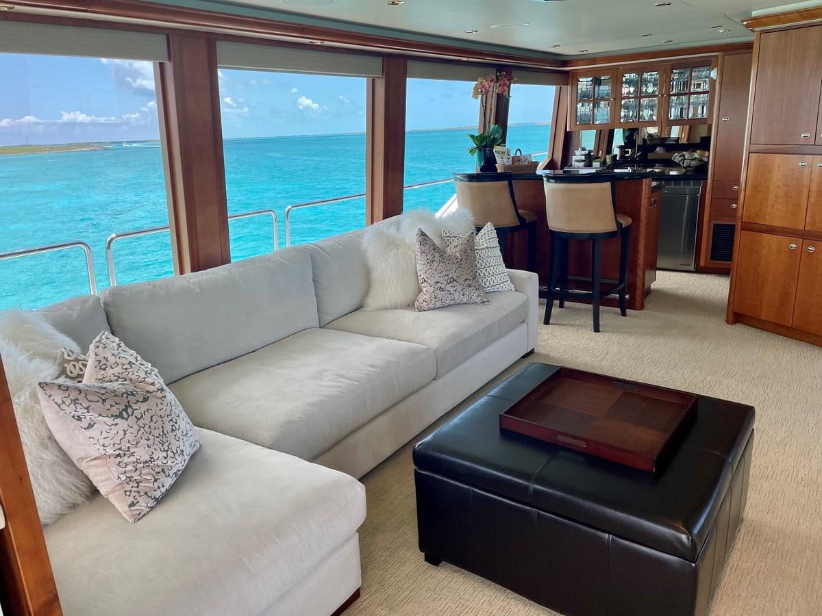 a living room with a large window aboard RELENTLESS Yacht for Sale