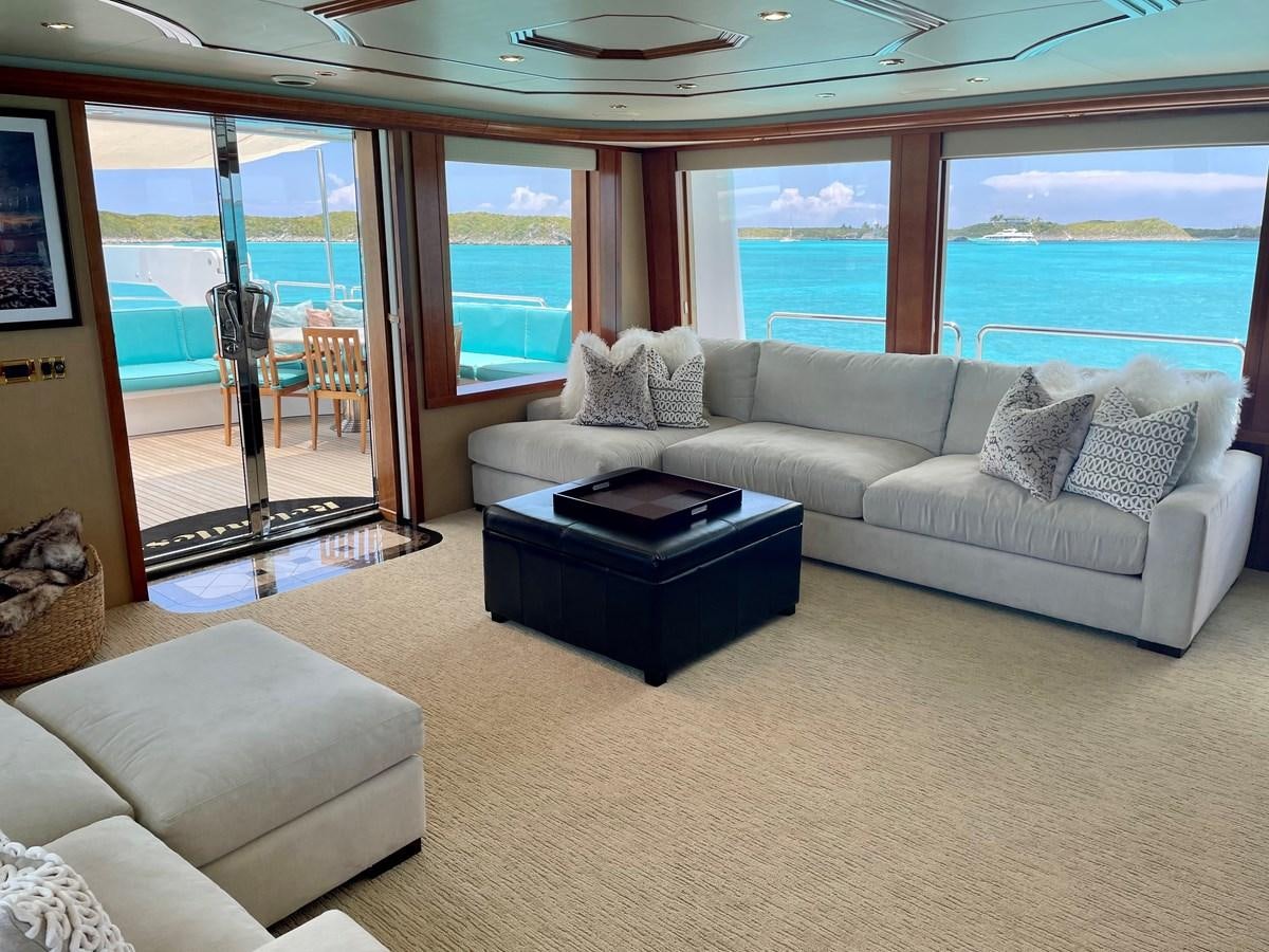 a living room with a large window aboard RELENTLESS Yacht for Sale
