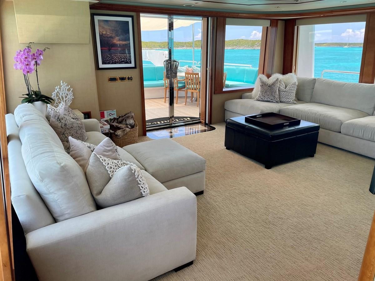 a living room with a large window aboard RELENTLESS Yacht for Sale