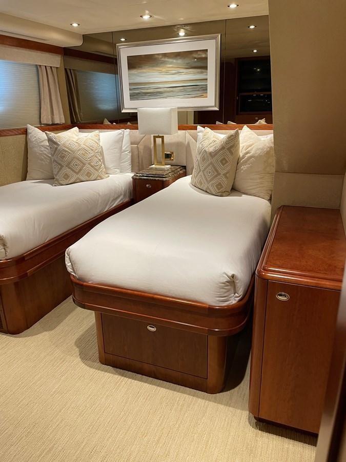 a room with a bed and a desk aboard RELENTLESS Yacht for Sale