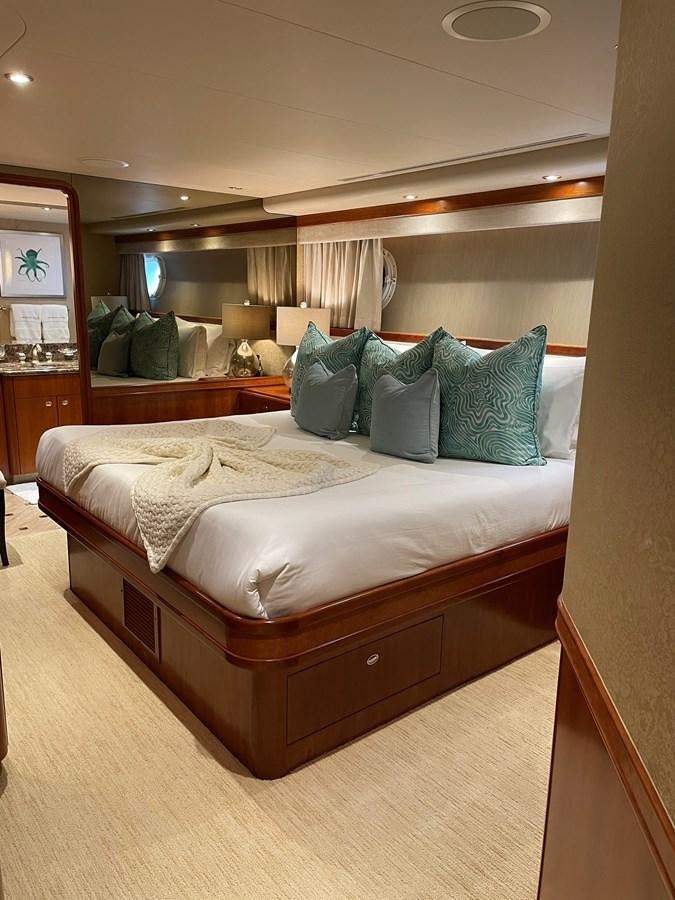 a bed with pillows aboard RELENTLESS Yacht for Sale