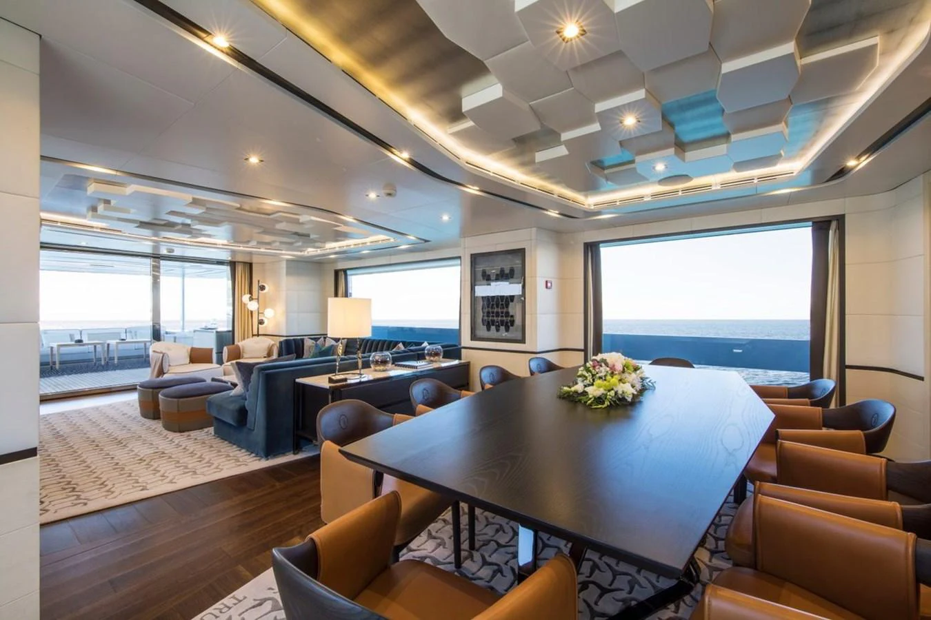 a large room with a table and chairs aboard SPRING Yacht for Sale