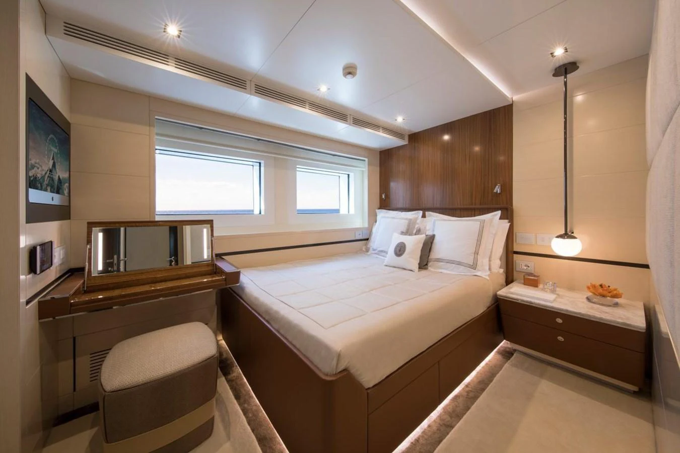 a bedroom with a bed and a desk aboard SPRING Yacht for Sale