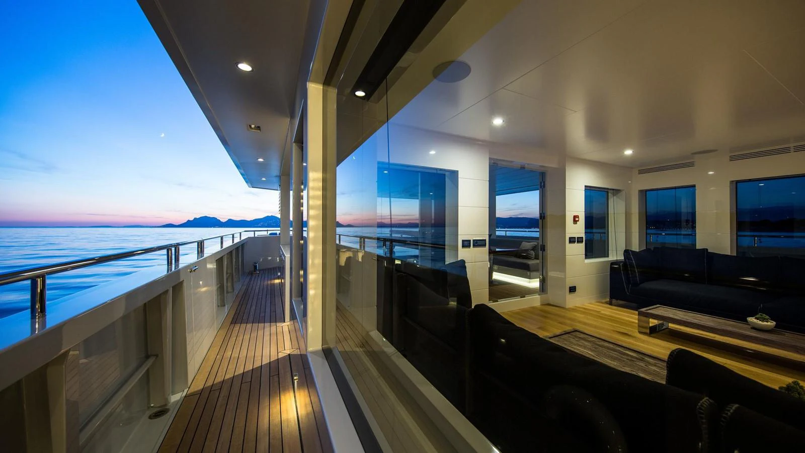 a wood deck with a large window overlooking a large body of water aboard S7 Yacht for Sale