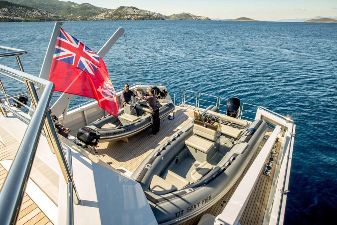 a boat with a flag on it aboard S7 Yacht for Sale