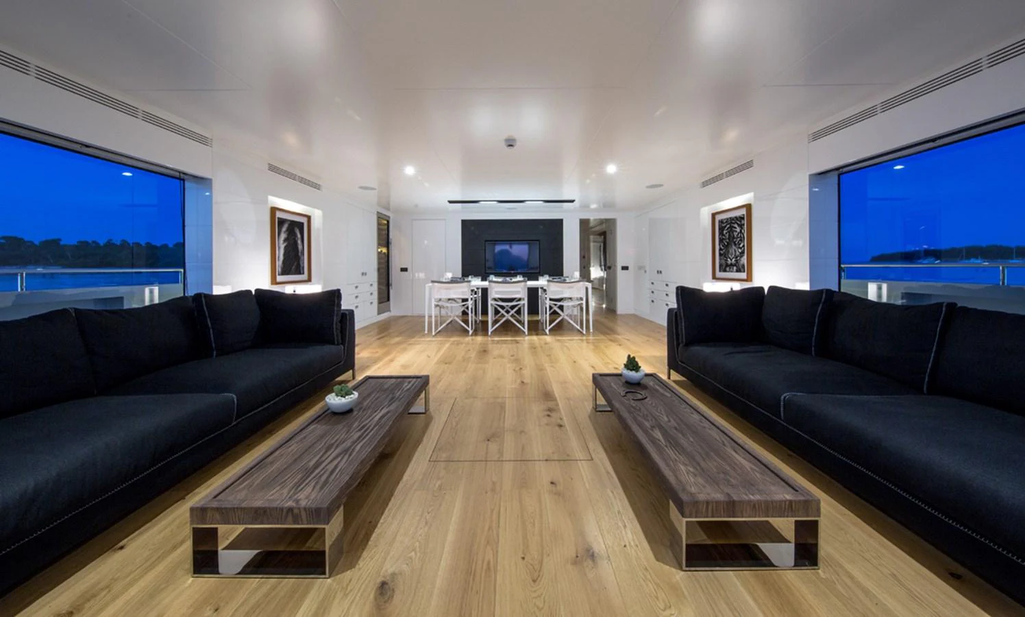a living room with a wood floor aboard S7 Yacht for Sale