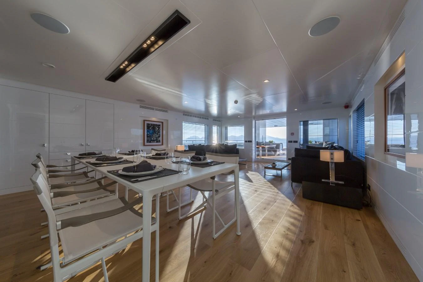 a large kitchen with a dining table aboard S7 Yacht for Sale